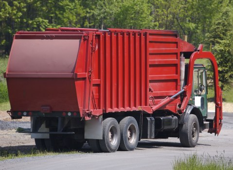 Staff conducting a site visit to inspect waste containers